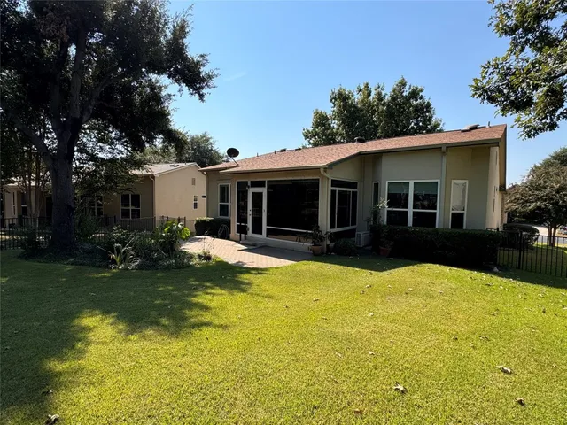 a view of a house with swimming pool and porch with furniture