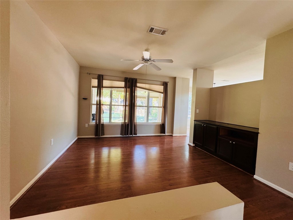 127 Verbena Drive Georgetown, TX 78633 - Photo 7 of 12 wooden floor in an empty room with a window