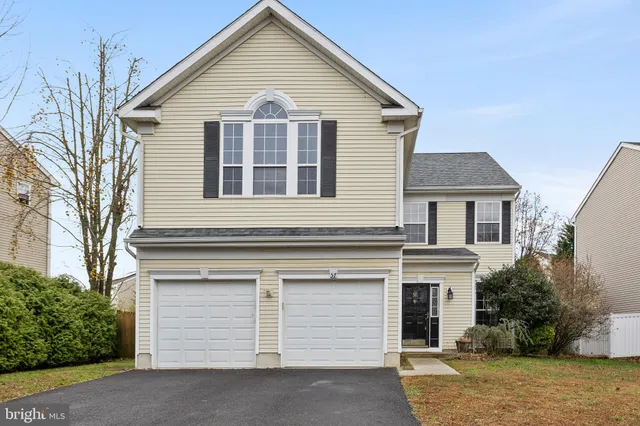 a view of house that has a window and garage