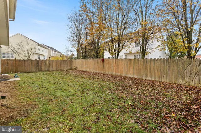 a view of a backyard of the house