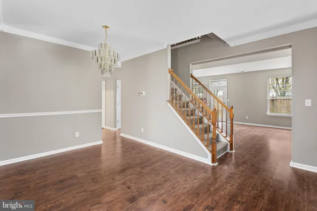 a view of an entryway with wooden floor