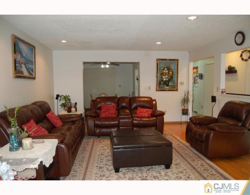 4406 Hana Road Edison, NJ 08817 - Photo 3 of 10 a living room with furniture and a couch