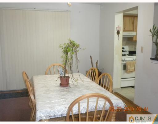 4406 Hana Road Edison, NJ 08817 - Photo 4 of 10 a dining room with furniture and wooden floor