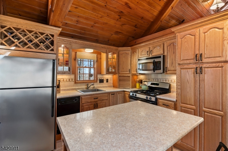 5 Anawa Road Vernon, NJ 07422 - Photo 12 of 44 a kitchen with a refrigerator a stove sink and microwave