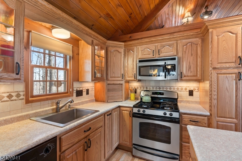 5 Anawa Road Vernon, NJ 07422 - Photo 13 of 44 a kitchen with granite countertop a sink stainless steel appliances and cabinets