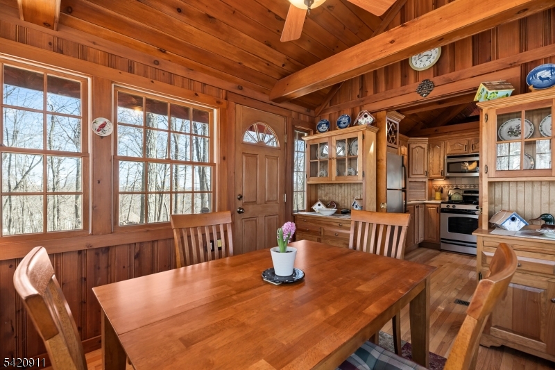 5 Anawa Road Vernon, NJ 07422 - Photo 16 of 44 a view of a dining room with furniture window and wooden floor
