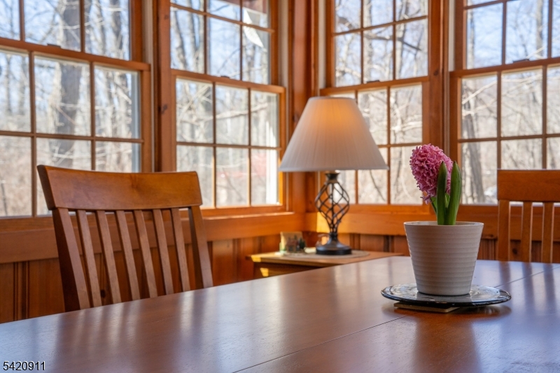 5 Anawa Road Vernon, NJ 07422 - Photo 17 of 44 a view of a dining room with furniture a chandelier and wooden floor