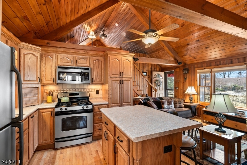 5 Anawa Road Vernon, NJ 07422 - Photo 3 of 44 a kitchen with stainless steel appliances a stove a refrigerator and a dining table