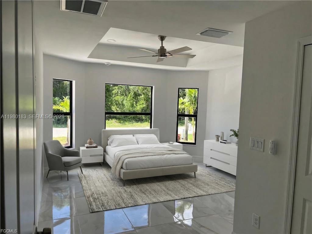 4854 30th Street Southwest, Unit 4854 Lehigh Acres, FL 33973 - Photo 5 of 11 a en suite bathroom with a granite countertop tub and a window