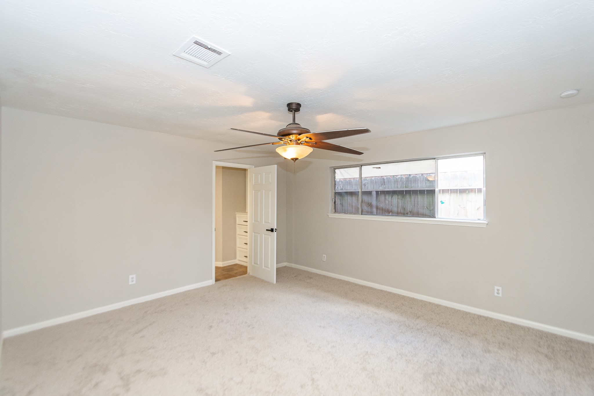 29019 Stapleford Street Spring, TX 77386 - Photo 19 of 27 a view of an empty room with a window