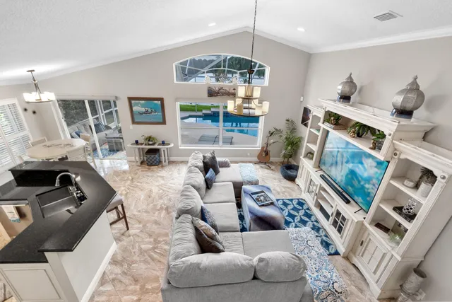 a living room with furniture fireplace and a flat screen tv
