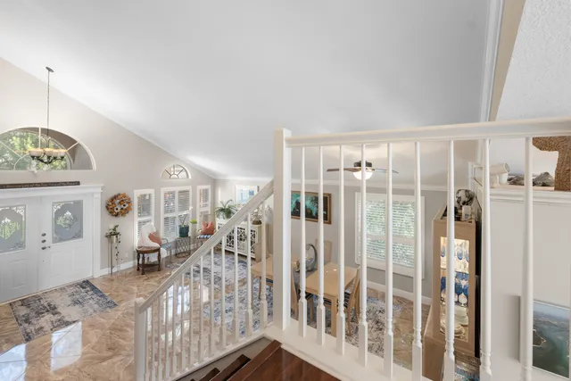 a view of a livingroom with wooden floor and a large window