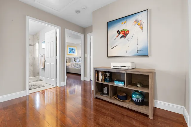 a view of an entryway with wooden floor