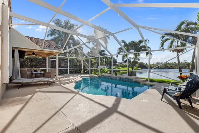 a view of a swimming pool with a patio