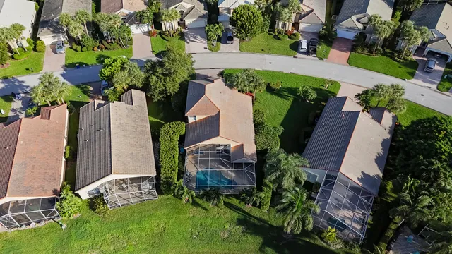 an aerial view of a house with a yard and garden