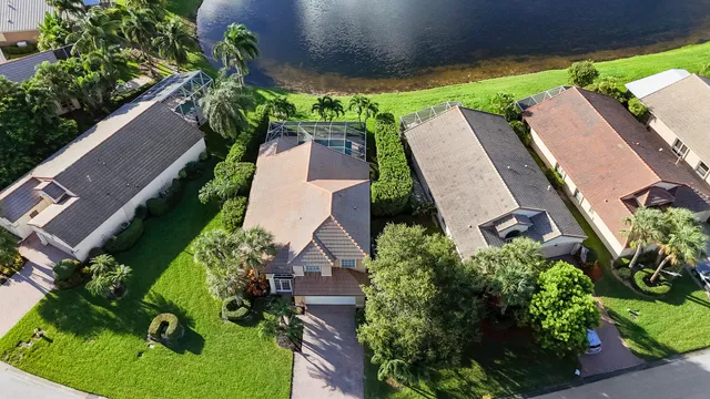 an aerial view of a house with a yard