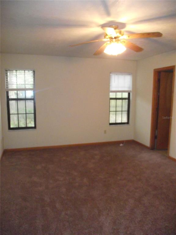 2624 Northwest 4th Avenue Gainesville, FL 32607 - Photo 13 of 14 an empty room with windows and closet
