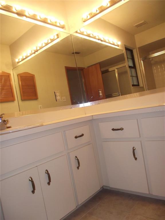 2624 Northwest 4th Avenue Gainesville, FL 32607 - Photo 14 of 14 a bathroom with a sink and mirror