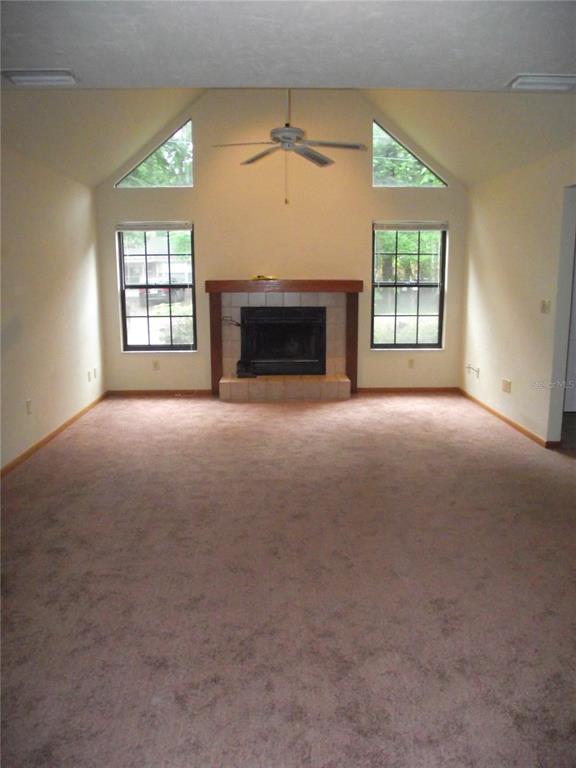 2624 Northwest 4th Avenue Gainesville, FL 32607 - Photo 2 of 14 an empty room with windows and fireplace