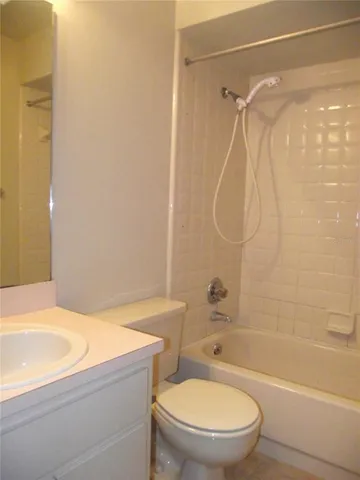 a bathroom with a bathtub and a toilet