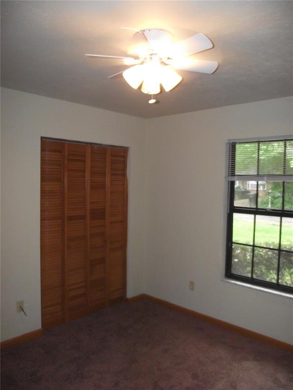 2624 Northwest 4th Avenue Gainesville, FL 32607 - Photo 7 of 14 an empty room with windows and closet