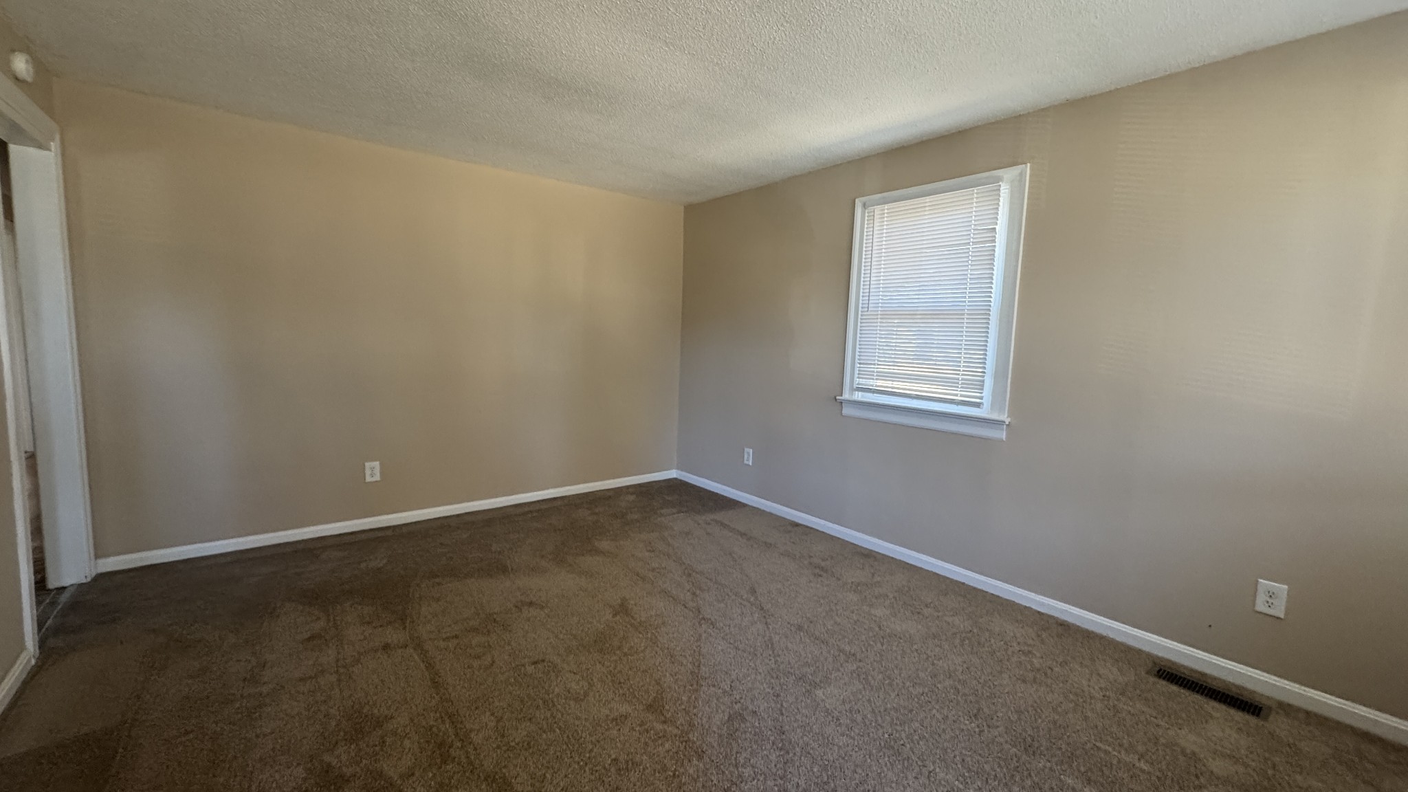 3038 Old Sango Road Clarksville, TN 37043 - Photo 2 of 9 an empty room with a window