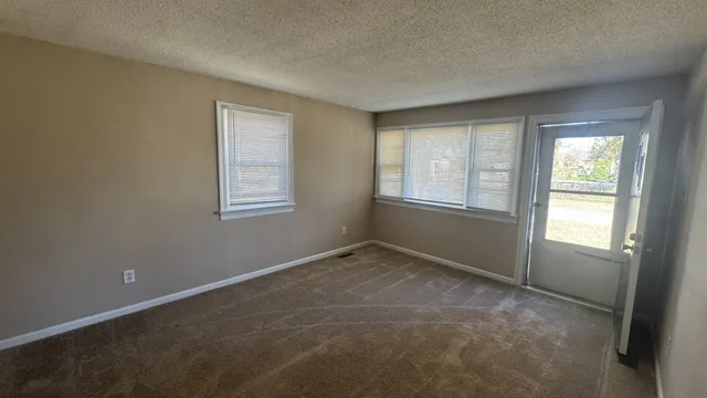 an empty room with windows