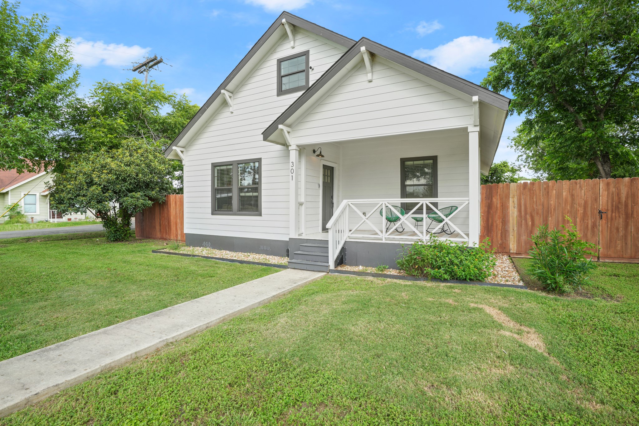 301 Old Thorndale Road Taylor, TX 76574 - Photo 2 of 29 A charming single-story residence with a welcoming front porch and well-maintained lawn.
