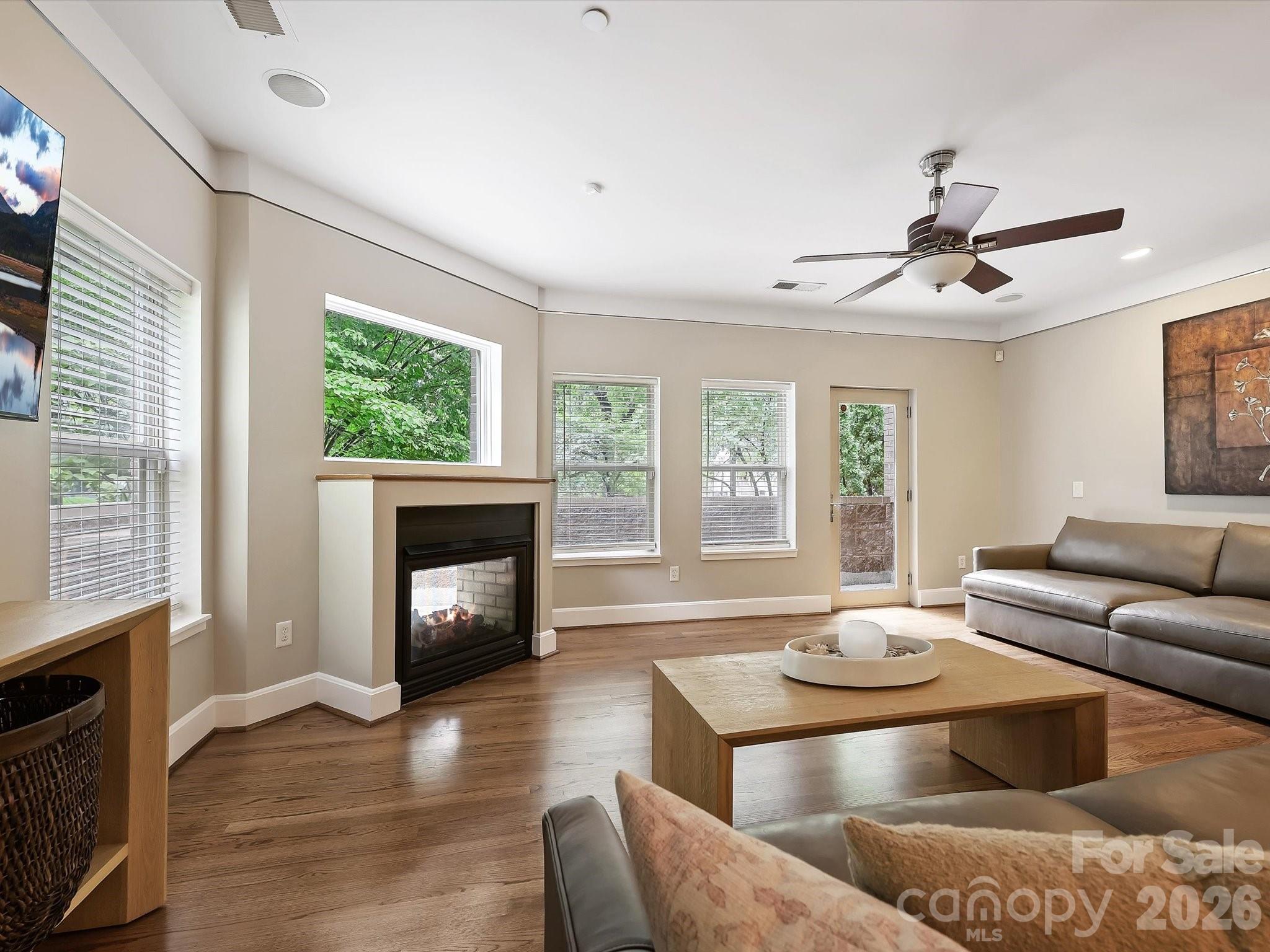 420 Queens Road Charlotte, NC 28207 - Photo 14 of 35 a living room with furniture and a fireplace