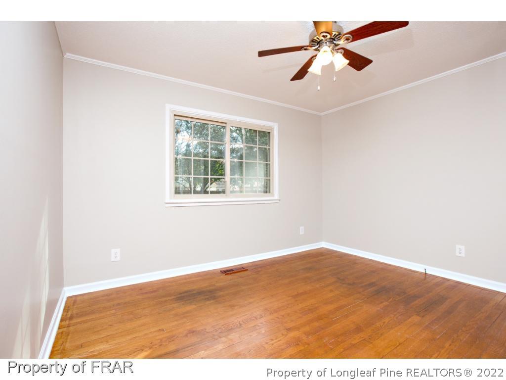 426 Hallmark Road Fayetteville, NC 28303 - Photo 20 of 36 an empty room with fan and windows