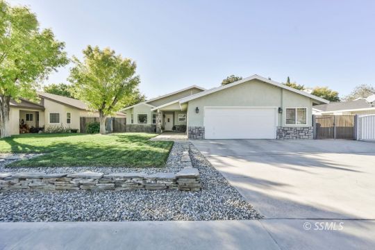1113 Amie Court Ridgecrest, CA 93555 - Photo 1 of 33 a front view of a house with a yard and garage