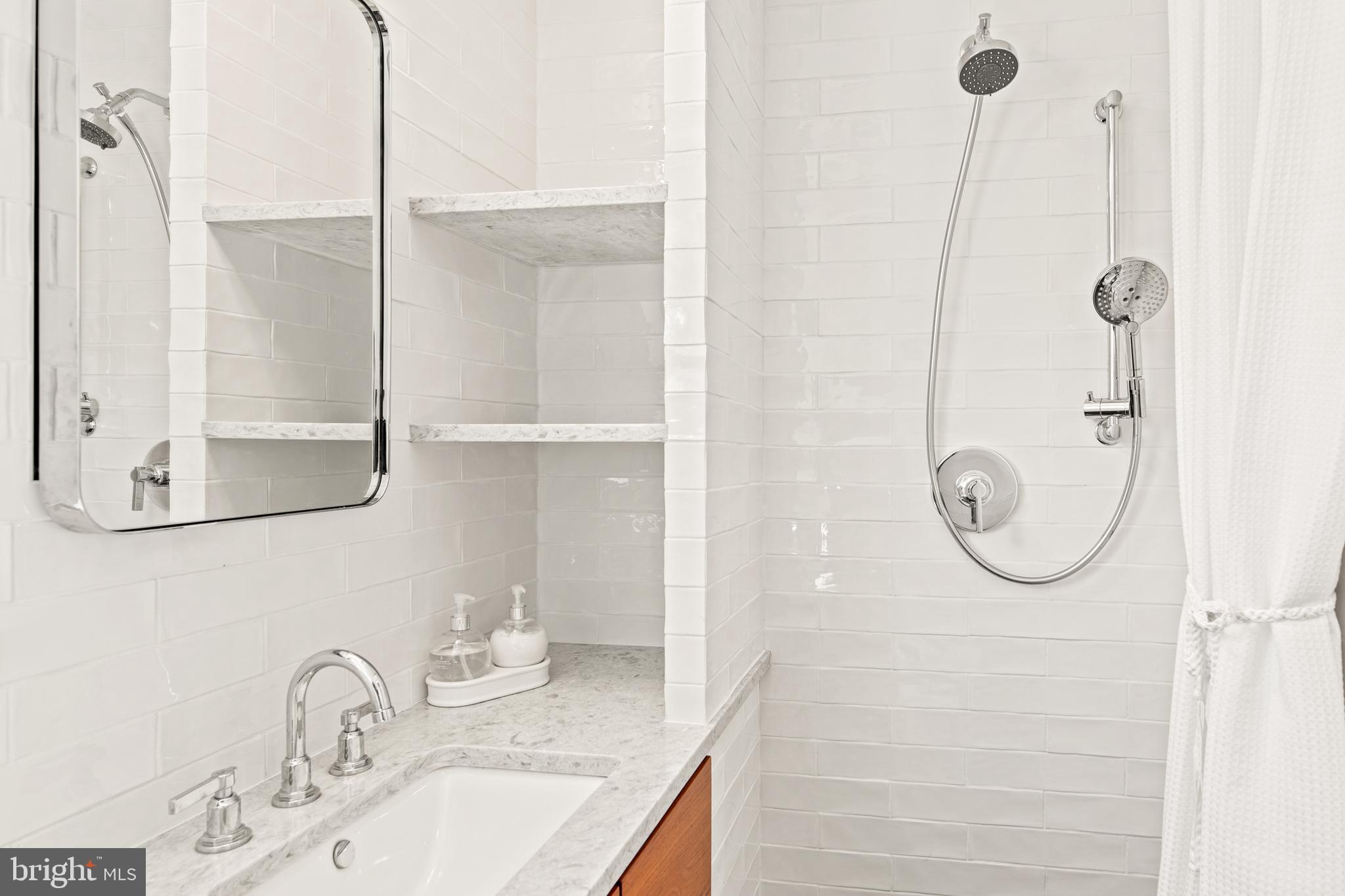 1 Marlyn Circle Wayne, PA 19087 - Photo 19 of 33 a bathroom with a granite countertop shower a mirror and vanity