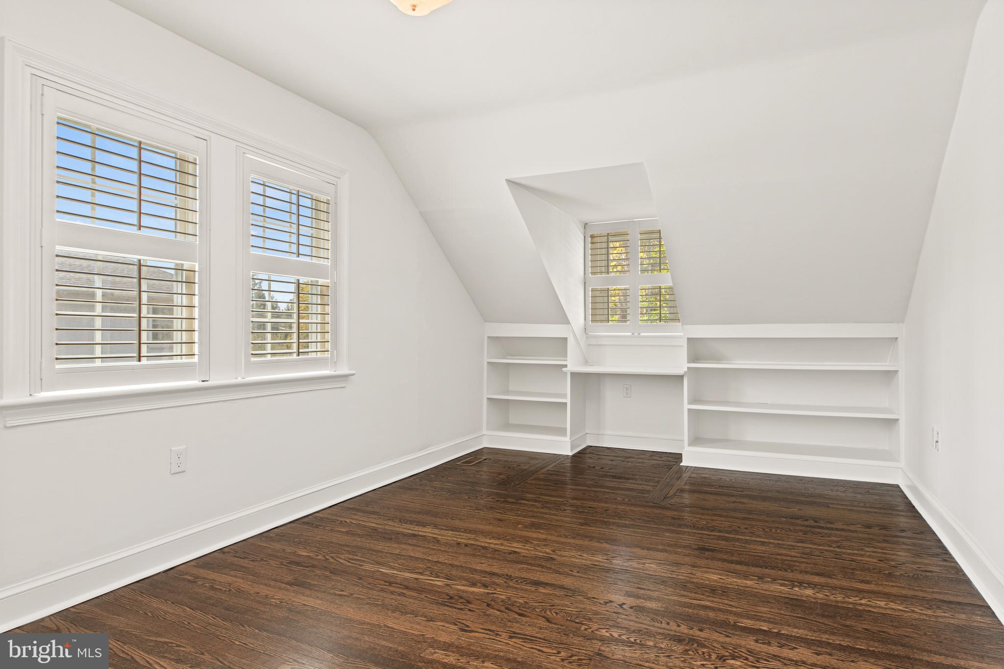 1 Marlyn Circle Wayne, PA 19087 - Photo 23 of 33 a view of an empty room with a window and wooden floor