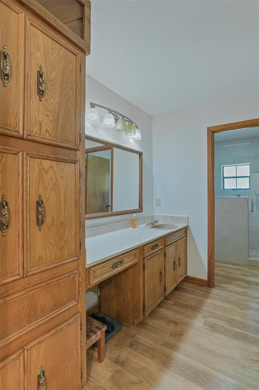 10307 Pirogue Road Oil City, LA 71061 - Photo 14 of 36 a bathroom with a tub sink and mirror