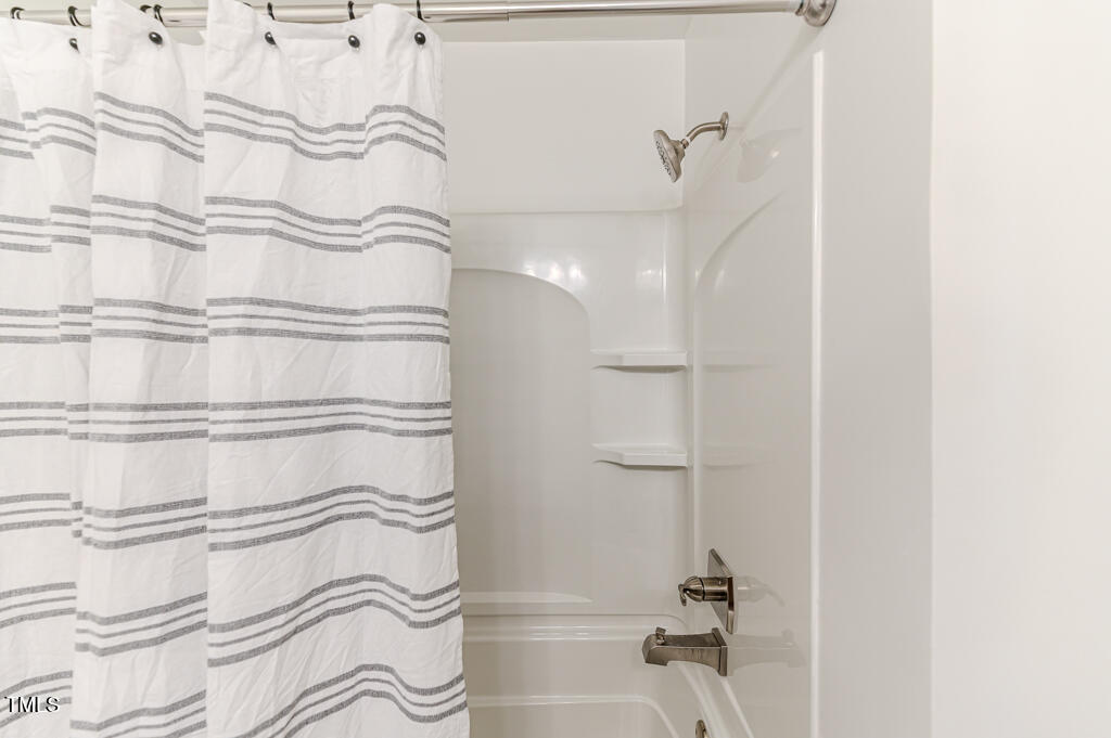 117 Johnson Street Broadway, NC 27505 - Photo 16 of 29 a bathroom with a bathtub and shower
