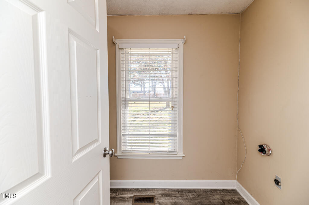 117 Johnson Street Broadway, NC 27505 - Photo 19 of 29 a view of an empty room with a window
