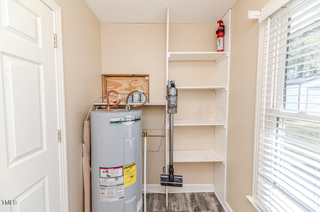 117 Johnson Street Broadway, NC 27505 - Photo 20 of 29 a room with storage and utility