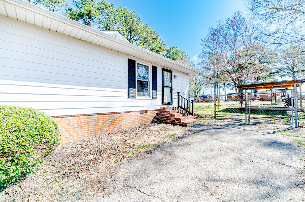 117 Johnson Street Broadway, NC 27505 - Photo 25 of 29 a view of a yard with a patio