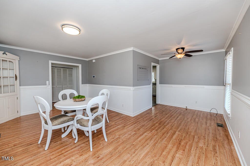 117 Johnson Street Broadway, NC 27505 - Photo 29 of 29 a view of a dining room with furniture and wooden floor