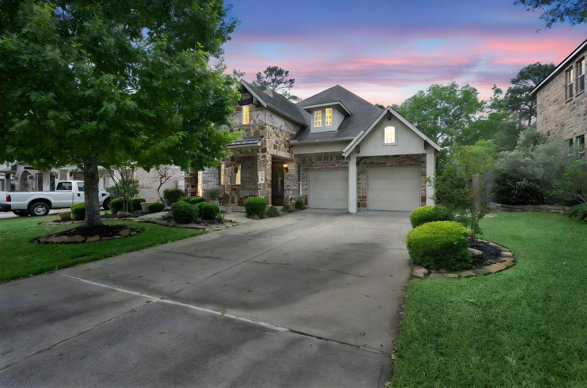a front view of a house with a garden