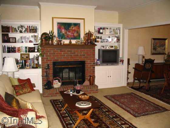 558 Lindley Road Greensboro, NC 27410 - Photo 6 of 9 Other. Living room with brick fireplace