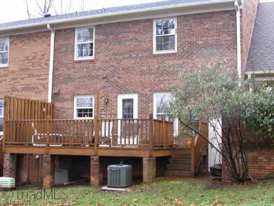 558 Lindley Road Greensboro, NC 27410 - Photo 9 of 9 Other. Rear view of townhome & deck
