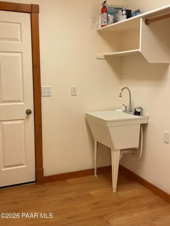 an empty room with a window and closet