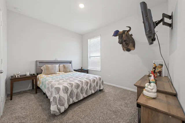 a bedroom with a bed and cabinets