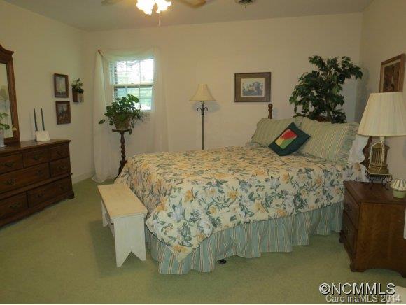 718 Union Road Rutherfordton, NC 28139 - Photo 13 of 24 a bed sitting in a bedroom next to a lamp with potted plant
