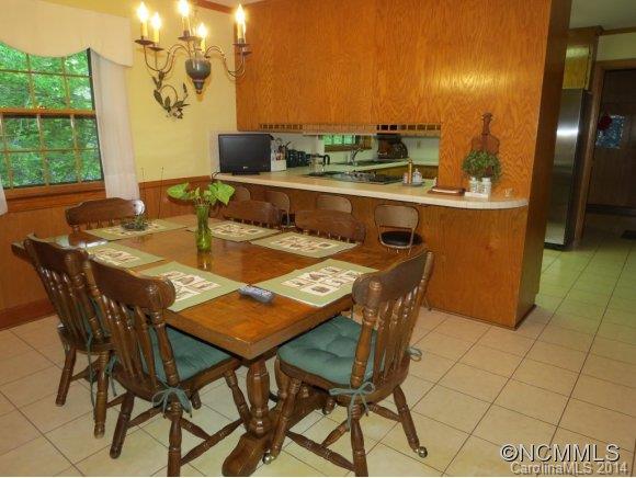718 Union Road Rutherfordton, NC 28139 - Photo 17 of 24 a dining room with stainless steel appliances a table and chairs