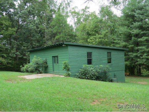 718 Union Road Rutherfordton, NC 28139 - Photo 5 of 24 a view of a backyard with potted plants and large trees