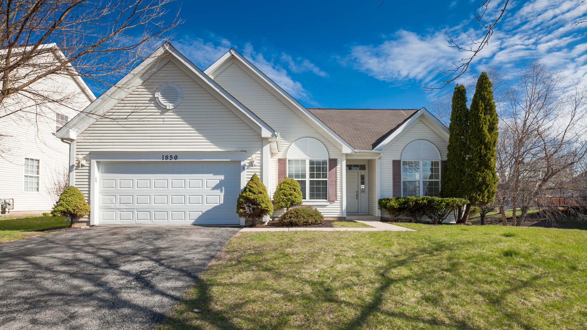 1850 Carrier Circle Plainfield, IL 60586 - Photo 1 of 13 a front view of a house with garden