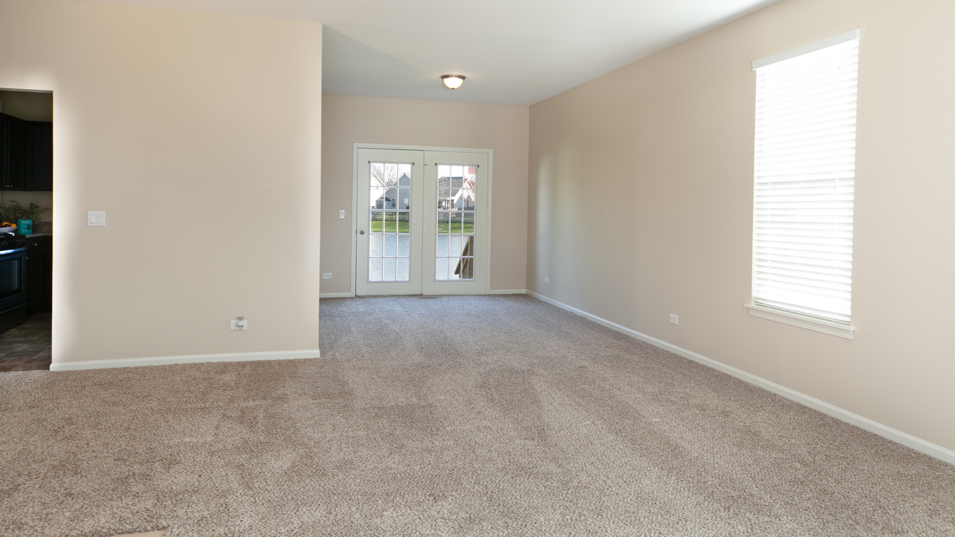 1850 Carrier Circle Plainfield, IL 60586 - Photo 3 of 13 an empty room with windows and outdoor view