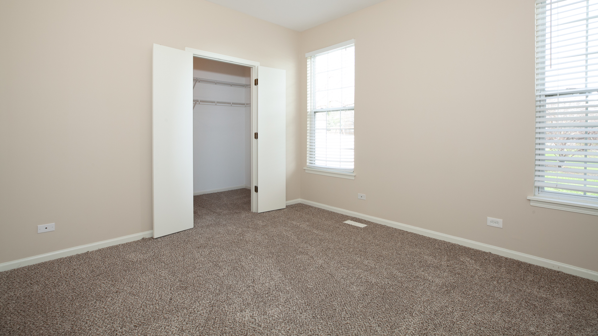 1850 Carrier Circle Plainfield, IL 60586 - Photo 5 of 13 an empty room with windows